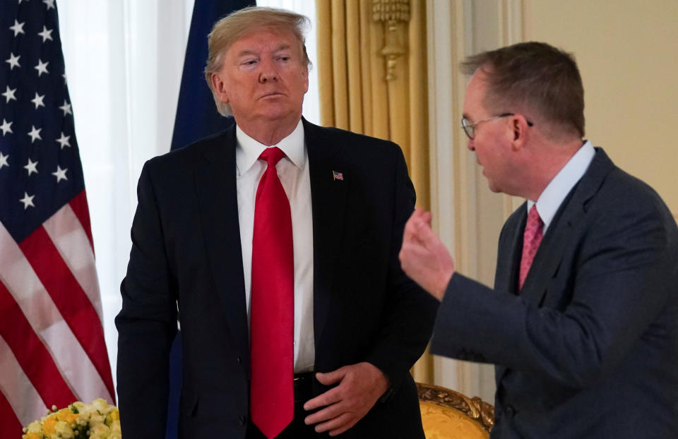 President Donald Trump looks at Acting White House Chief of Staff Mick Mulvaney during a meeting in December. (Photo: Kevin Lamarque / Reuters)