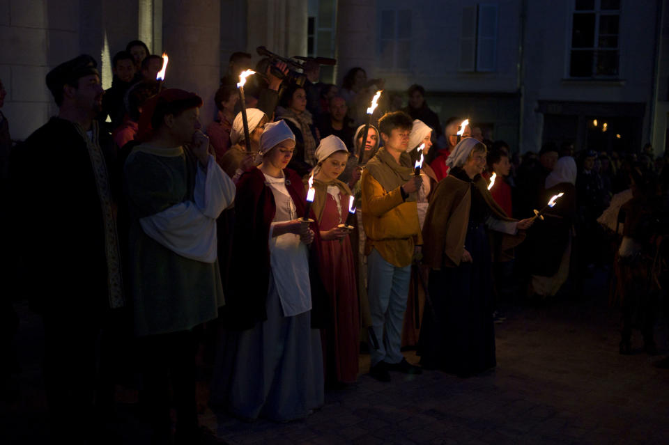 People dressed up like people from the Middle Age attend ceremonies marking the 600th anniversary of the birth of Joan of Arc, in Orleans, central France, Sunday April 29, 2012. The city of Orleans goes all out with celebrations marking the 600th birthday of Joan of Arc, a national icon and symbol of French resistance through the ages at a time when French identity and France's role in the world are a focus in the presidential campaign. (AP Photo/Thibault Camus)