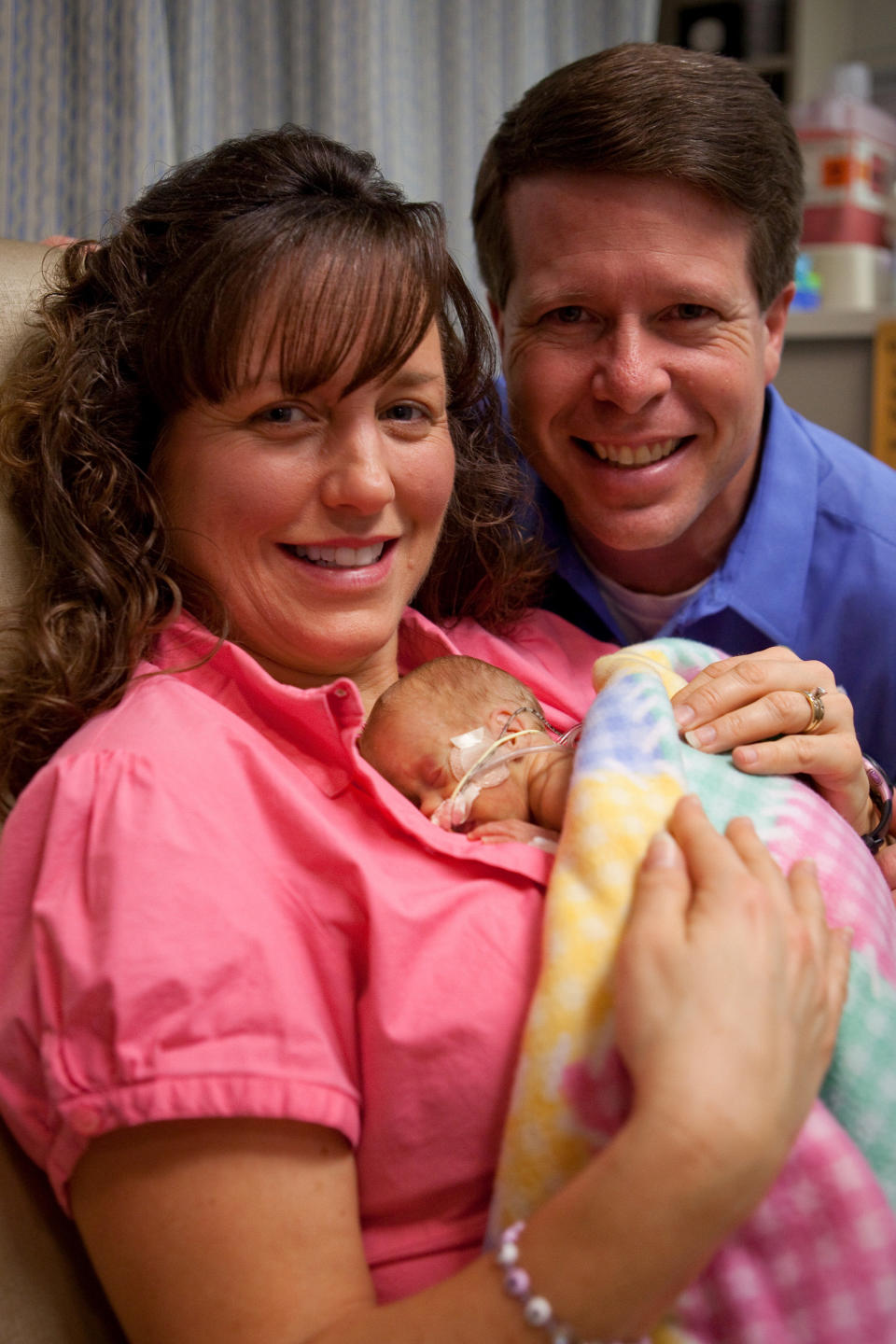 In this Jan. 18, 2010 publicity image released by TLC on Thursday, Jan. 28, Jim Bob and Michelle Duggar hold their daughter Josie Brooklyn Duggar, born Dec. 11, at Arkansas Children's Hospital in Little Rock, Ark. Josie, the Duggar's 19th child, will be introduced in a special "19 Kids and Counting: Special Duggar Delivery," airing Sunday, Jan. 31, at 8 p.m. EST on TLC. (AP Photo/TLC, Scott Enlow)