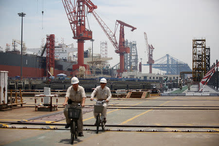 Labourers work at Shanghai Waigaoqiao Shipbuilding Co., Ltd. in Shanghai, China June 15, 2017. Picture taken June 15, 2017. REUTERS/Aly Song