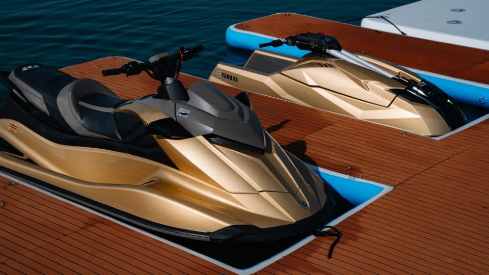Superyacht 'AK Royalty' with gold jet skis