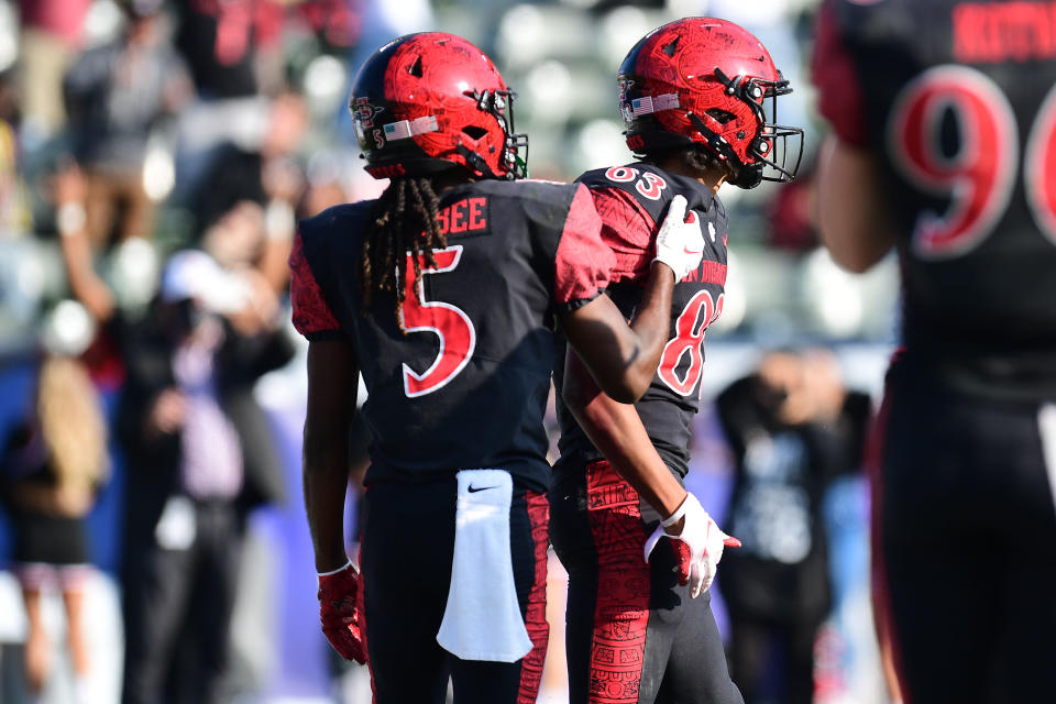 Dec. 4, 2021; Carson, California; San Diego State Aztecs wide receiver Mekhi Shaw (83) celebrates with wide receiver BJ Busbee (5) his touchdown against the Utah State Aggies during the first half of the Mountain West Conference championship at Dignity Health Sports Park. Gary A. Vasquez-USA TODAY Sports