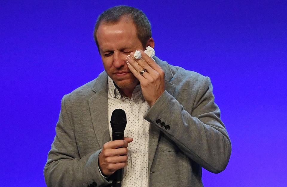 Lead Pastor Mark Vance breaks out in tears during the first Sunday service at Ames' Cornerstone Church since a June 2 shooting in the church's parking lot left three people dead.