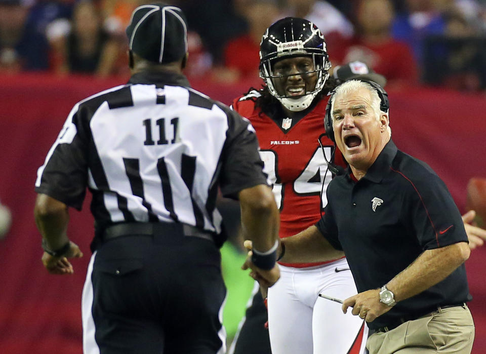 Atlanta Falcons head coach Mike Smith, right, argues for a pass interference call on a play involving wide receiver Roddy White, center, with an official during the second half of their NFL football game against the Denver Broncos, Monday, Sept. 17, 2012, in Atlanta. The Falcons won 27-21. (AP Photo/Atlanta Journal-Constitution, Curtis Compton) MARIETTA DAILY OUT; GWINNETT DAILY POST OUT; LOCAL TV OUT; WXIA-TV OUT; WGCL-TV OUT