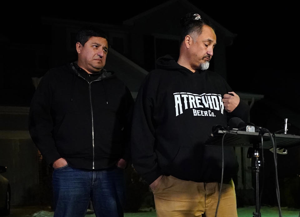 Richard Fierro, right, talks with his brother Ed Fierro about his efforts to subdue the gunman in Saturday's fatal shooting at Club Q, during a news conference Monday, Nov. 21, 2022, outside his home in in Colorado Springs, Colo. (AP Photo/Jack Dempsey)