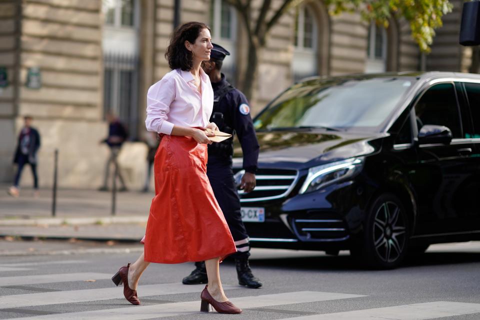 Turn up the volume on your wardrobe building blocks by finding a midi skirt in a really loud hue. Style it with a blush blouse and dark, chunky heels.