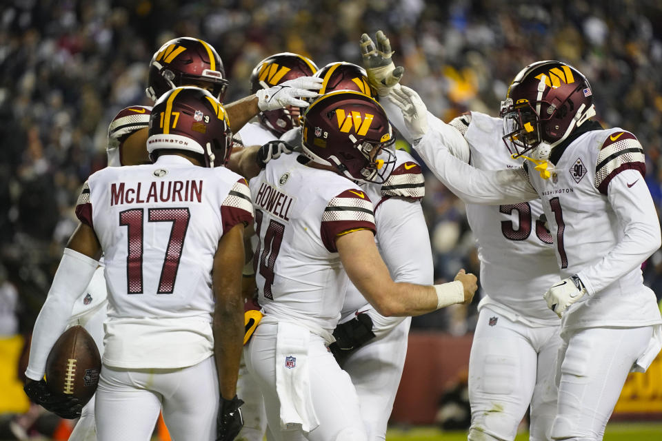 Washington Commanders quarterback Sam Howell (14) celebrating his touchdown against the Dallas Cowboys during the second half an NFL football game, Sunday, Jan. 8, 2023, in Landover, Md. (AP Photo/Patrick Semansky)