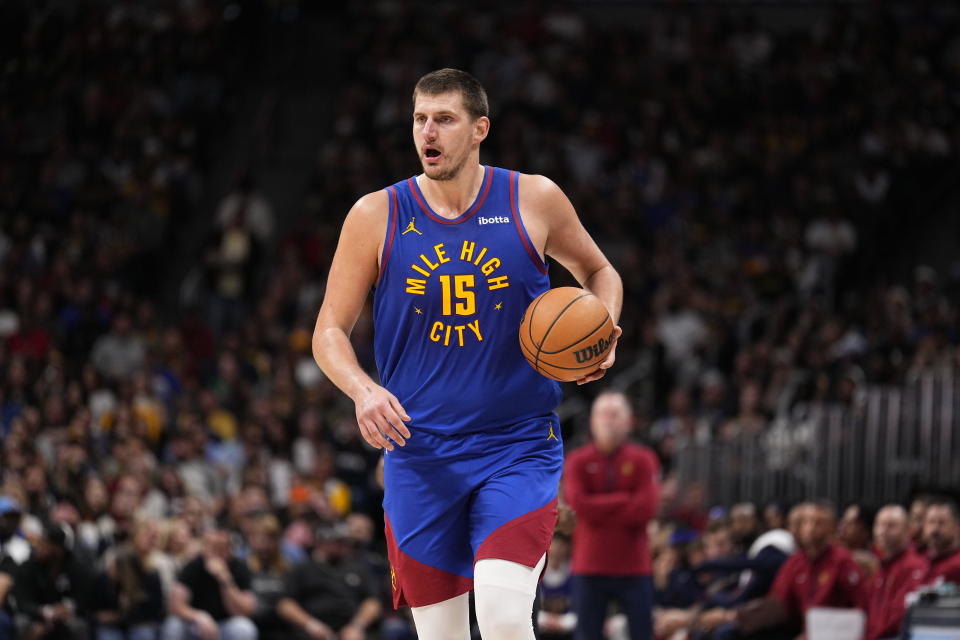 Denver Nuggets center Nikola Jokic brings the ball up against the Chicago Bulls during the second quarter of an NBA basketball game Saturday, Nov. 4, 2023, in Denver. (AP Photo/Jack Dempsey)