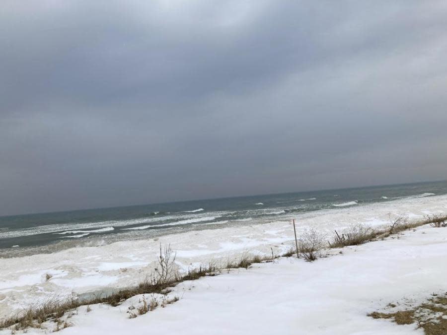 Lake Michigan shoreline in Ottawa County, Mich., is shown on Feb. 1, 2022. Despite its closeness to the lake, the county has areas where household and business wells are running short of water. That’s because the aquifer beneath the county has dropped significantly in recent decades and it has no connection to the lake. Experts say Ottawa County is a cautionary tale for the state of Michigan, which is trying to leverage its water abundance to build a “blue economy” as climate change brings more drought and depleted aquifers to much of the U.S. (AP Photo/John Flesher)