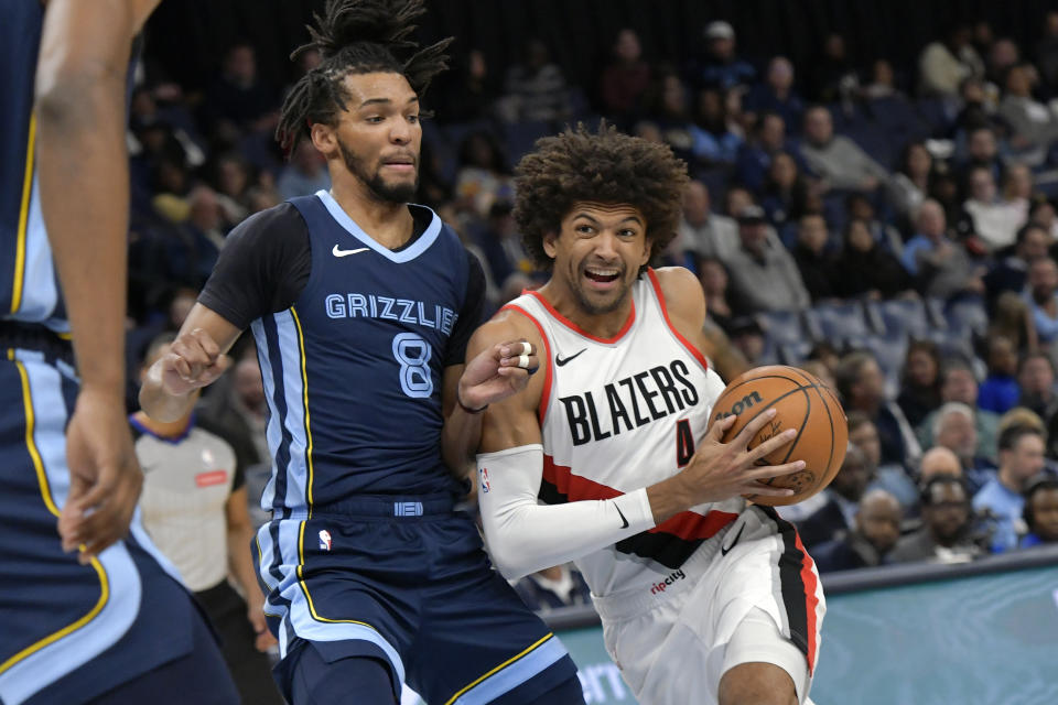 Portland Trail Blazers guard Matisse Thybulle, right, drives against Memphis Grizzlies forward Ziaire Williams (8) in the first half of an NBA basketball game Friday, March 1, 2024, in Memphis, Tenn. (AP Photo/Brandon Dill)