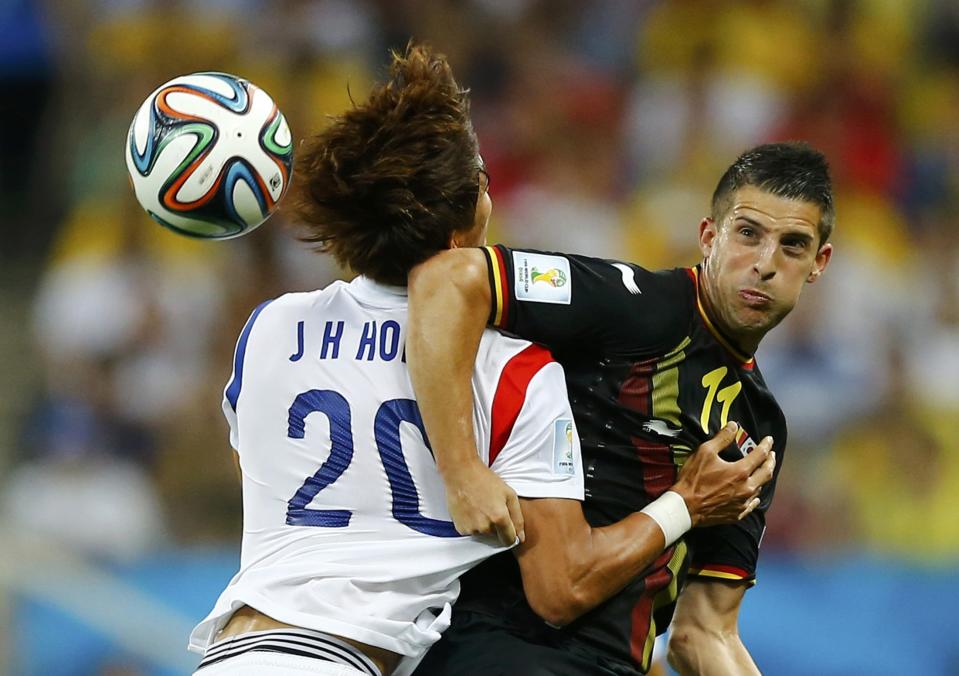 South Korea's Hong fights for the ball with Belgium's Mirallas during their 2014 World Cup Group H soccer match at the Corinthians arena in Sao Paulo