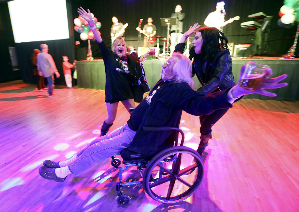 "We did it!" yells Shawn McDonald, center, as he celebrates with Teisha Martinez, left, and Aubrey Taylor after a local media outlet called results showing Proposition 2 passed at the Proposition 2 election night party at the Infinity Event Center in Salt Lake City, Utah, on Tuesday, Nov. 6, 2018. Proposition 2 legalizes the medical use of marijuana for individuals with qualifying medical illnesses. (Kristin Murphy/The Deseret News via AP)