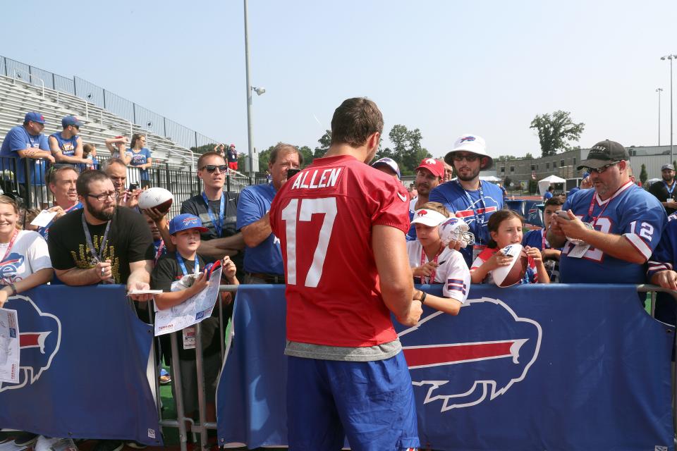 Quarterback Josh Allen sign autographs for fans at the end of training camp at St. John Fisher College.