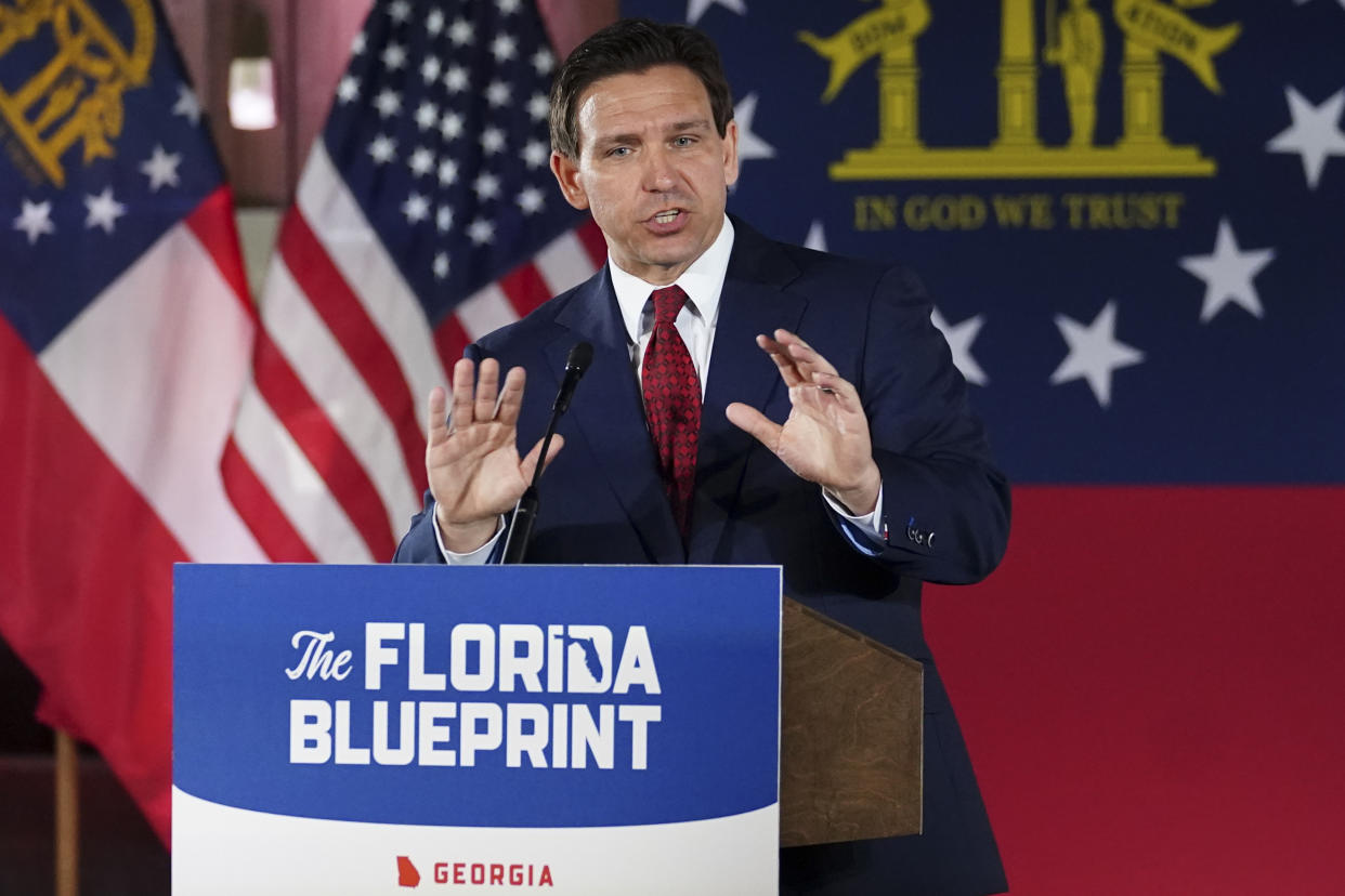 FILE - Florida Gov. Ron DeSantis speaks to a crowd at Adventure Outdoors gun store, Thursday, March 30, 2023, in Smyrna, Ga. DeSantis, who is widely expected to announce a campaign and is seen as former President Donald Trump’s top rival, accused prosecutors of stretching the law to target an opponent. But his remarks came a week after DeSantis took a shot at the tawdry circumstances underlying the case when asked to comment on it. (AP Photo/John Bazemore, File)