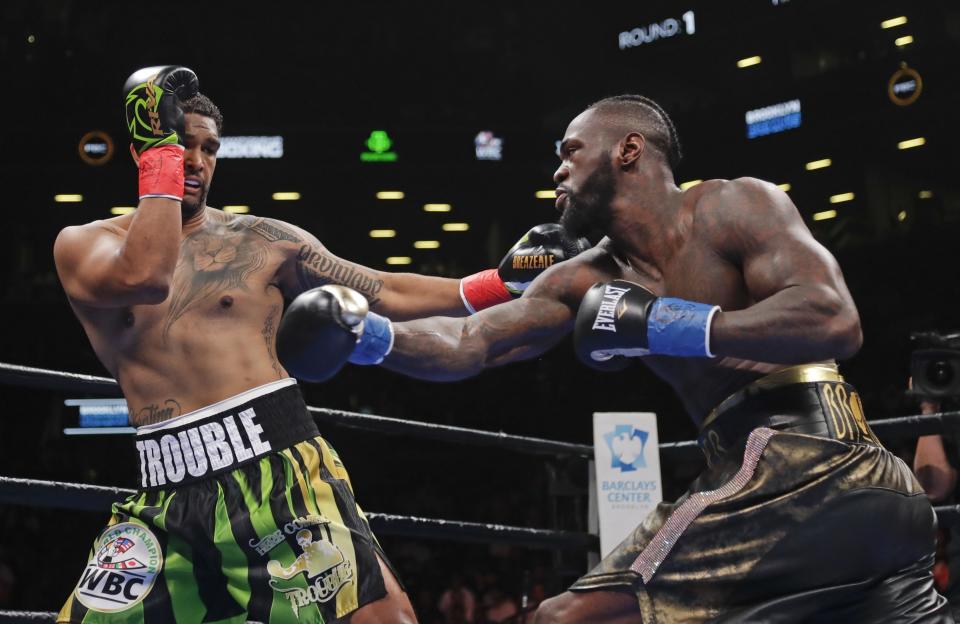 Dominic Breazeale, left, evades a right from Deontay Wilder during the first round of the WBC heavyweight championship boxing match Saturday, May 18, 2019, in New York. Wilder won in the first round.(AP Photo/Frank Franklin II)