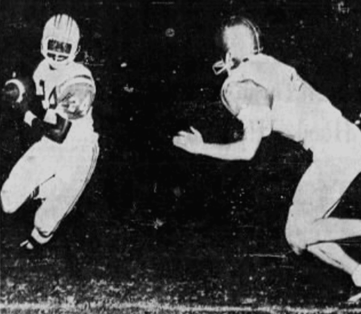 Bob Rowan (right) of Cardinal Newman seeks to tackle Samuel Clark (left) from Kennedy High School in a 1967 high school football game.