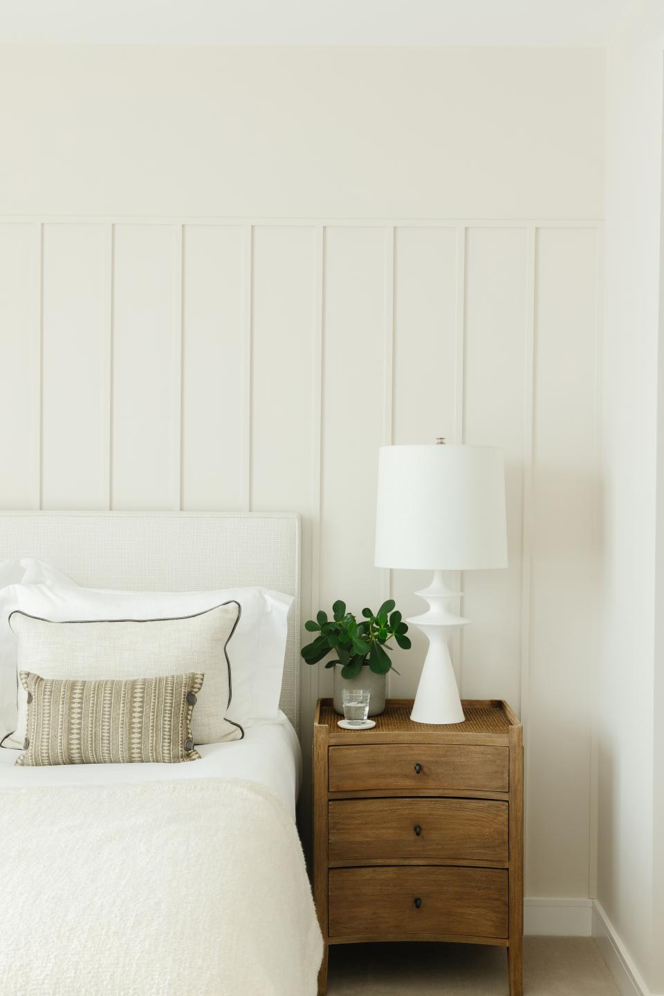 white bedroom with slim shaker paneling