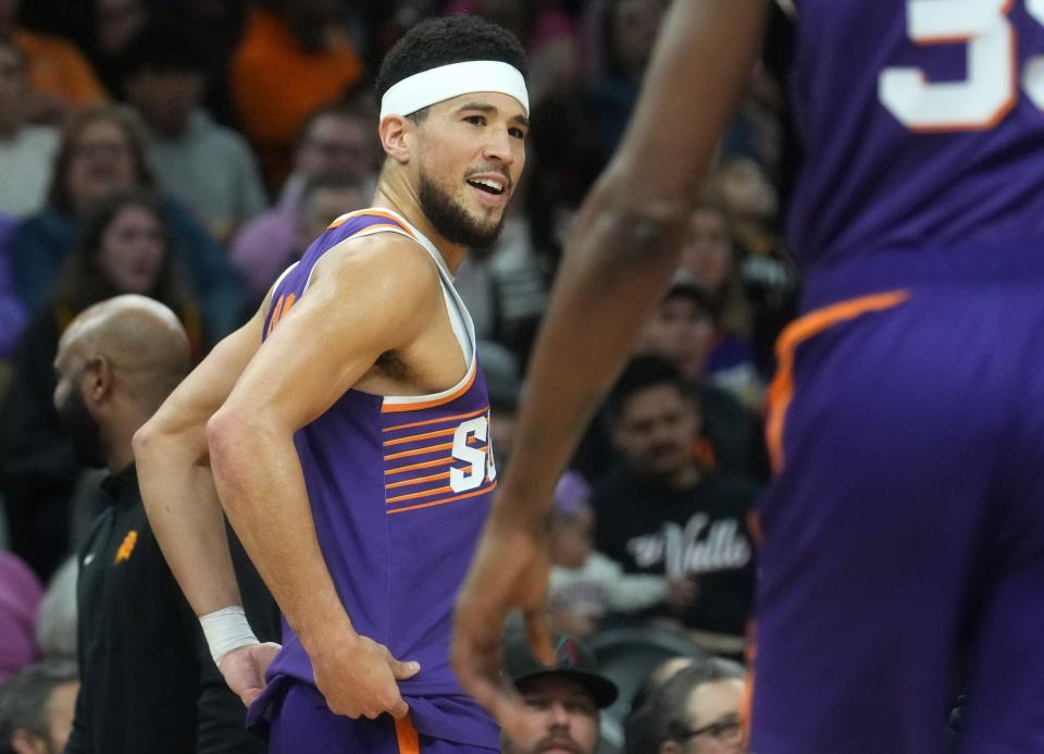 Phoenix Suns guard Devin Booker (1) looks at the referee after being ejected during their game against the Detroit Pistons at Footprint Center in Phoenix on Feb. 14, 2024.