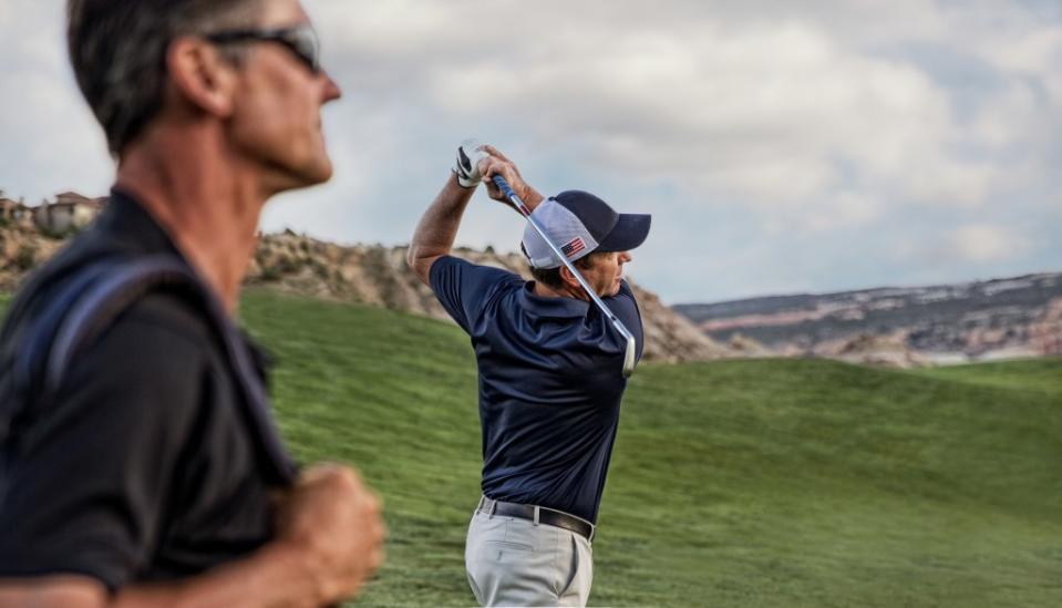 Golfers on fairway via Gett Images/<br>Ken Redding