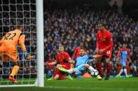 <p>Aguero stretches for the shot on goal </p>