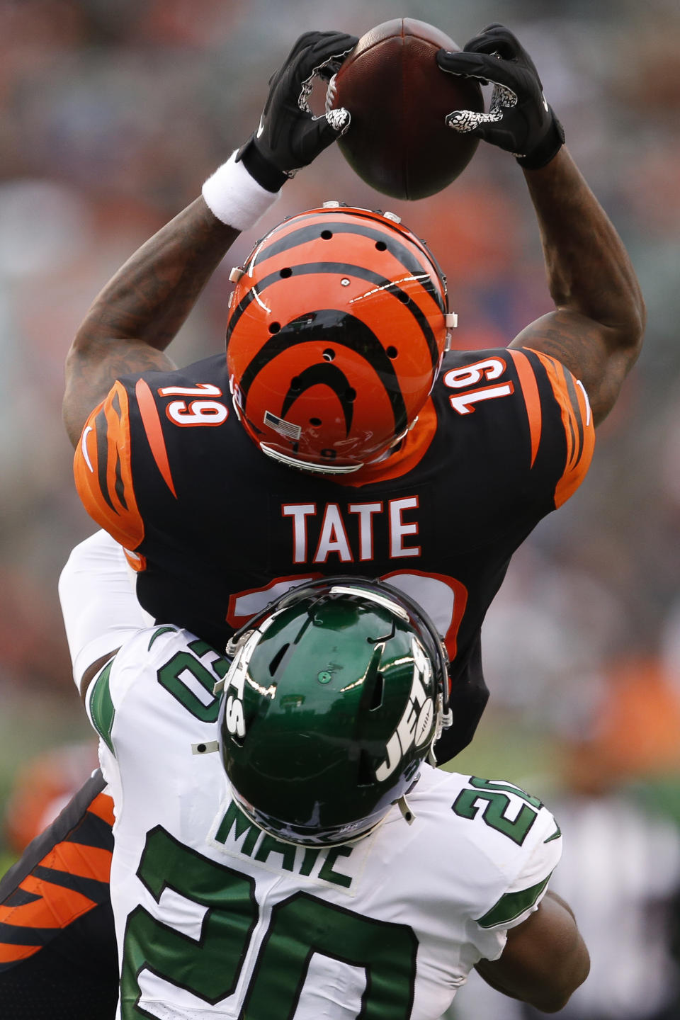 Cincinnati Bengals wide receiver Auden Tate (19) catches a pass against New York Jets free safety Marcus Maye (20) during the first half of an NFL football game, Sunday, Dec. 1, 2019, in Cincinnati. (AP Photo/Gary Landers)