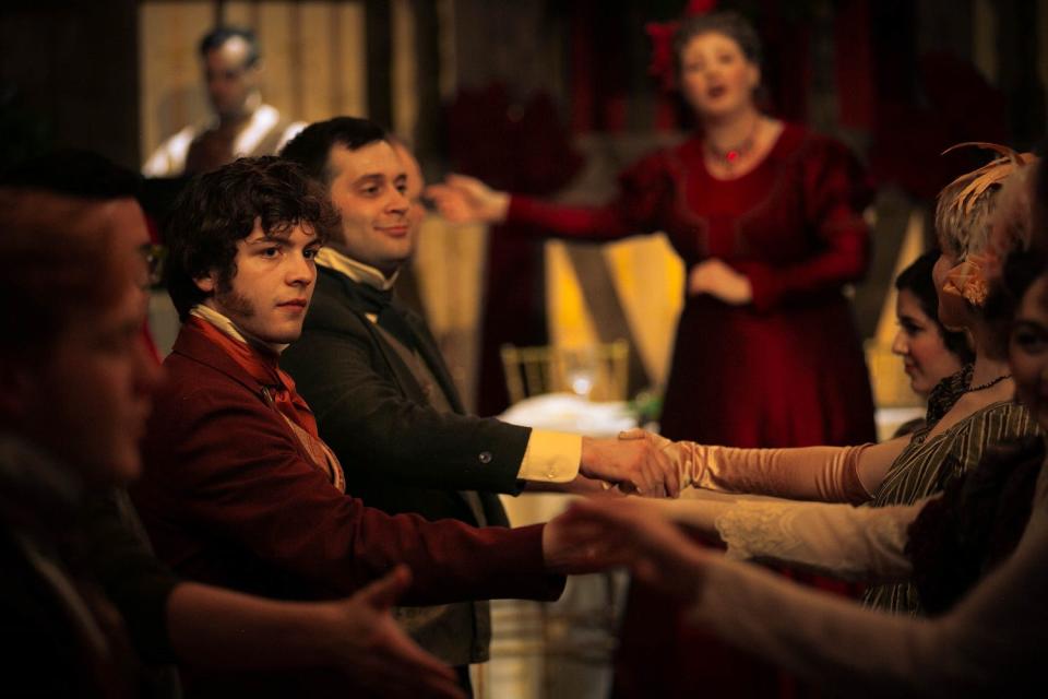 Cast members Nick Hone, left, and Matthew Moreillon dance with attendees at Oklahoma Shakespeare in the Park's 2019 production of "Jane Austen's Christmas Cracker," an interactive holiday production.