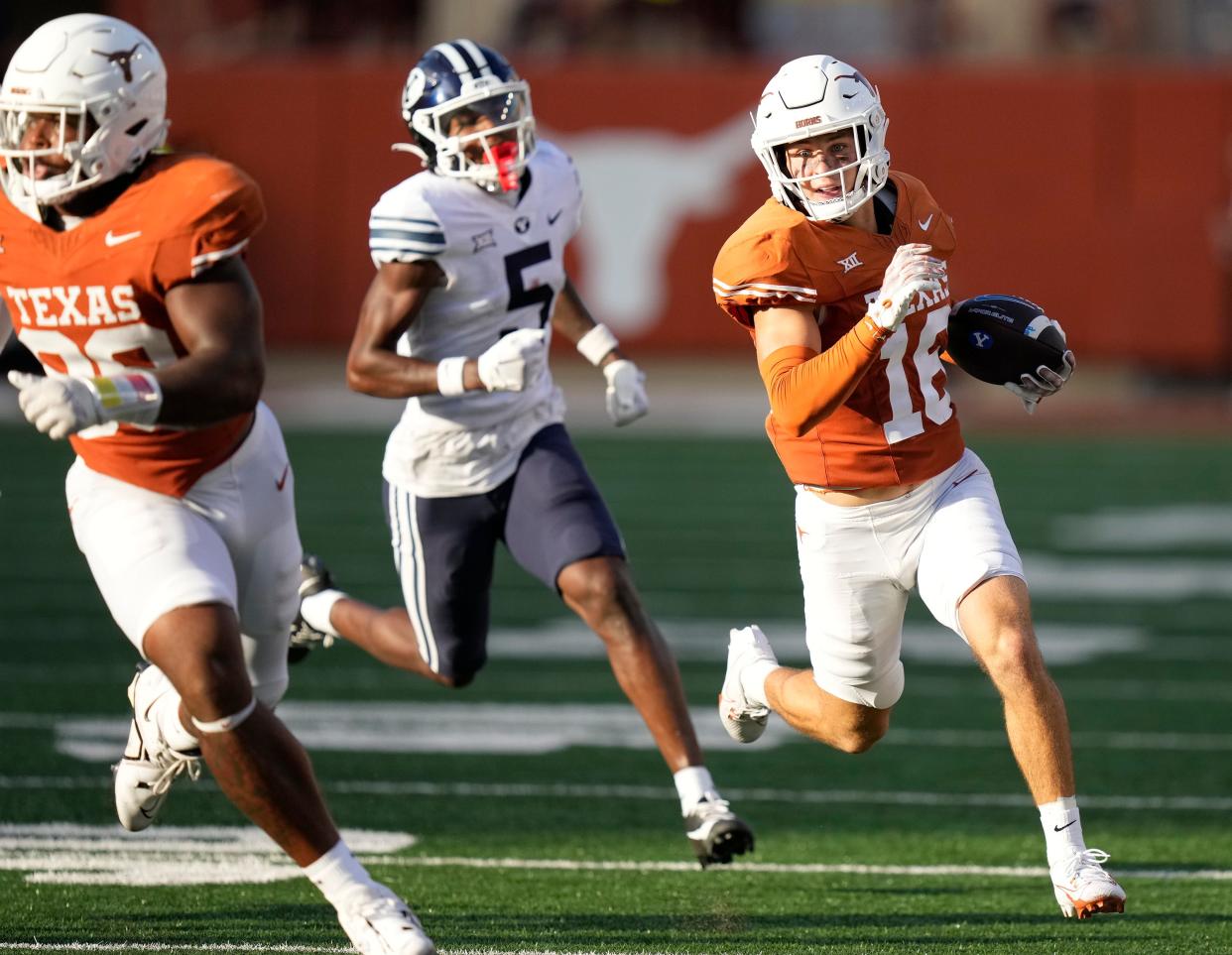Texas safety Michael Taaffe returns an interception 45 yards in the fourth quarter against BYU. His second pick in as many games set up a late Longhorns touchdown.
