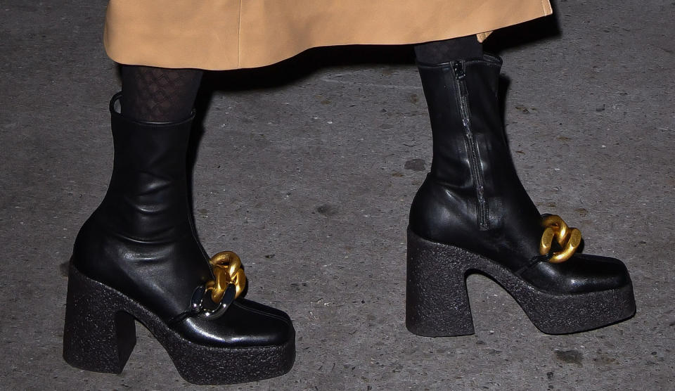 Taylor Swift, Stella McCartney, boots, black boots, womens boots, platforms, platform boots, platform heels, block heels, chain boots, chains, chain shoes, footwear, womens footwear, vegan heels, vegan boots, Versace, handbag, tights, trench coat, leather coat, birthday, New York City