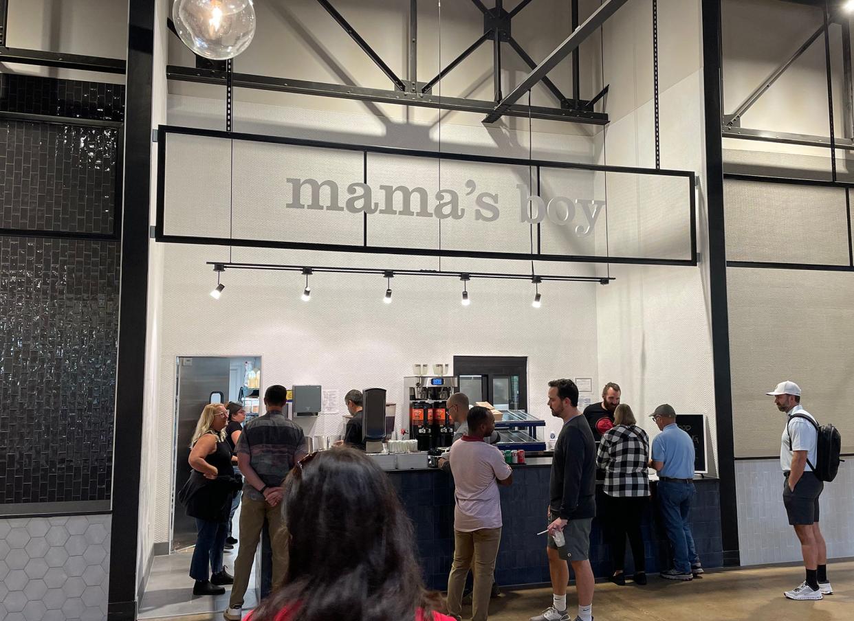 Customers place their orders on opening day of Mama's Boy restaurant at the Wire Park development in Watkinsville, Ga. on Wednesday, Sept. 20, 2023.  