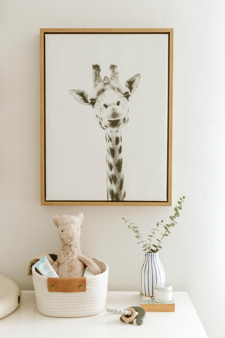 My minimalist safari theme started with wallpaper and this giraffe picture. I spotted this picture years ago and just knew I wanted it in my nursery.