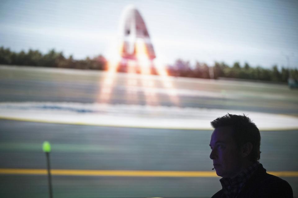 SpaceX CEO Elon Musk watches a video after unveiling the Dragon V2 spacecraft in Hawthorne, California May 29, 2014. Space Exploration Technologies, or SpaceX, on Thursday unveiled an upgraded passenger version of the Dragon cargo ship NASA buys for resupply runs to the International Space Station. (REUTERS/Mario Anzuoni)