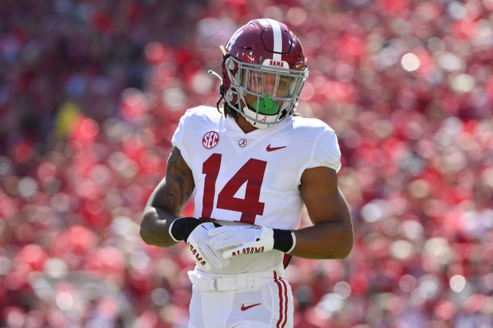 Alabama defensive back Brian Branch (14) runs a play against Arkansas during an NCAA college football game Saturday, Oct. 1, 2022, in Fayetteville, Ark. (AP Photo/Michael Woods)