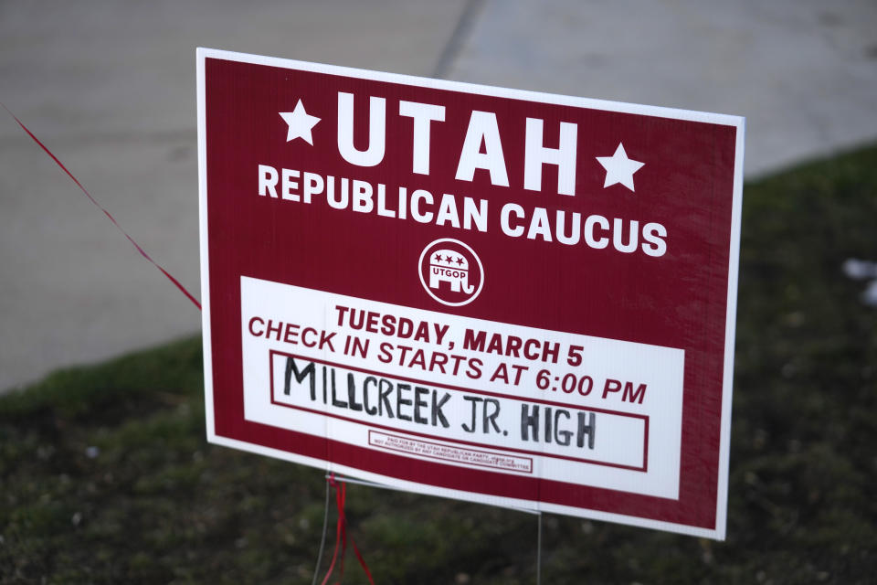 A Utah Republican caucus sign stands in front of Millcreek Junior High School Tuesday, March 5, 2024, in Bountiful, Utah. Republican voters gathered at neighborhood precincts across Utah on Super Tuesday to select a presidential nominee through an in-person candidate preference poll. (AP Photo/Rick Bowmer)