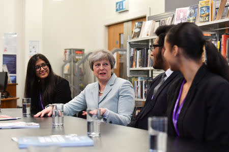 Britain's Prime Minister Theresa May visits the Featherstone High School in Southall in London, Britain, Febuary 19, 2018. REUTERS/Ben Stansall/Pool