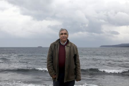 Caretaker Alekos Karagiorgis poses for a picture on a beach on the Greek island of Lesbos, February 4, 2016. REUTERS/Giorgos Moutafis