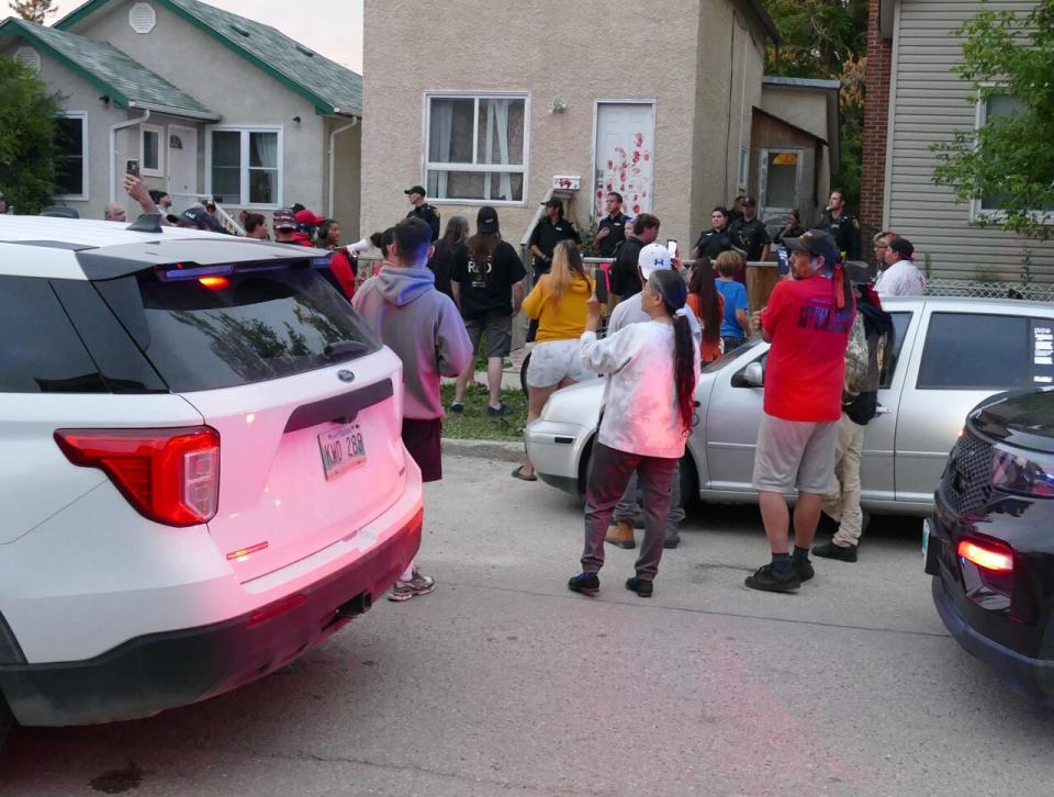 Protesters gather outside the house of Kyle Klochko.