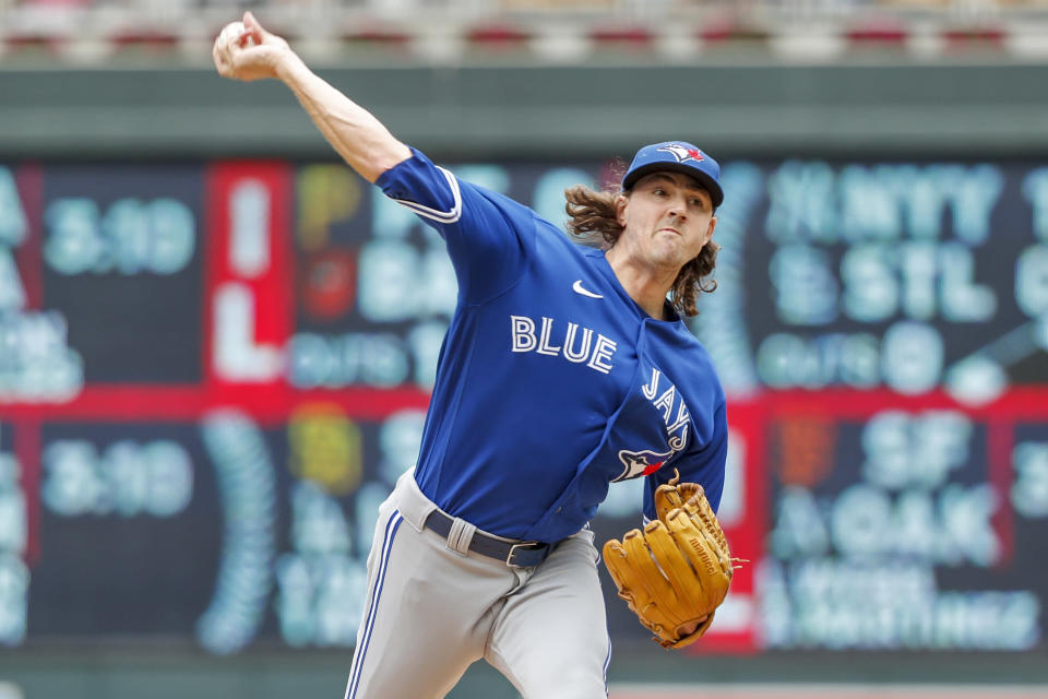 Toronto Blue Jays starting pitcher Kevin Gausman throws to a Minnesota Twins batter in the first inning of a baseball game Sunday, Aug. 7, 2022, in Minneapolis. (AP Photo/Bruce Kluckhohn)