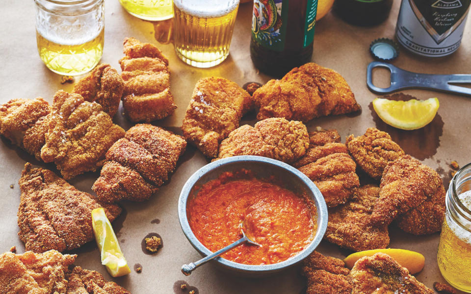 <p>Victor Protasio</p><p>Crispy, southern fried catfish with a hot sauce that will make you want a glass of milk.</p><p><strong>Get the recipe: <a href="https://parade.com/686190/parade/moms-fried-catfish-with-hot-sauce/" rel="nofollow noopener" target="_blank" data-ylk="slk:Fried Catfish with Hot Sauce;elm:context_link;itc:0;sec:content-canvas" class="link ">Fried Catfish with Hot Sauce</a></strong></p>