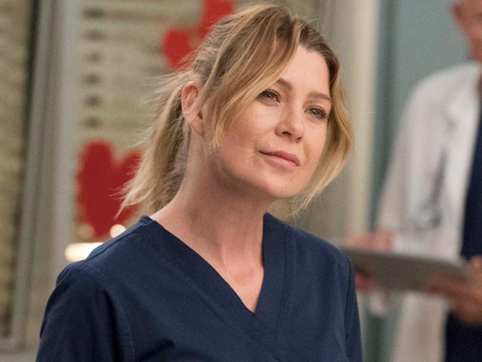 Ellen Pompeo in navy blue scrubs