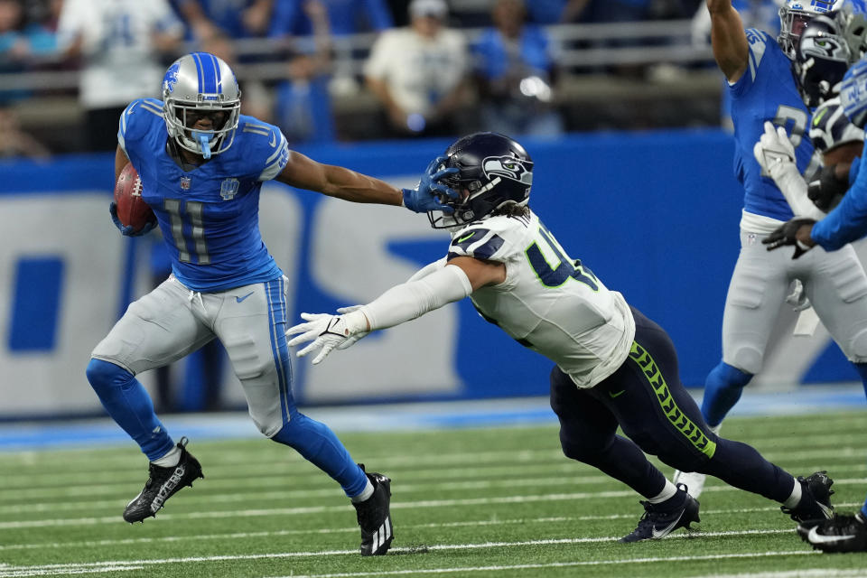 Detroit Lions wide receiver Kalif Raymond (11) runs from Seattle Seahawks linebacker Drake Thomas (42) during the second half of an NFL football game, Sunday, Sept. 17, 2023, in Detroit. (AP Photo/Paul Sancya)