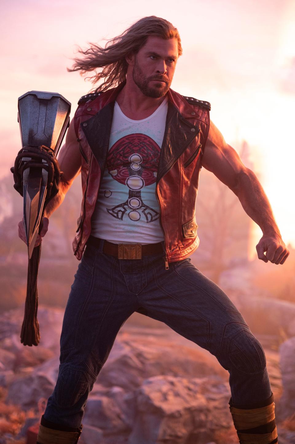 Chris Hemsworth with his three weapons (two arms, one axe) in "Thor: Love and Thunder."