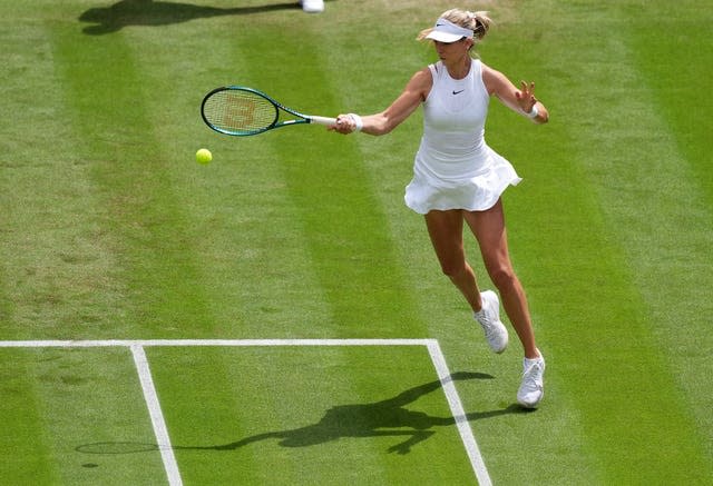 Katie Boulter swings to hit a forehand