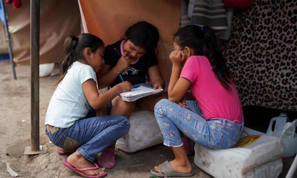 Elvia, nine, Sarai, 10, and Yadira, eight, asylum seekers from Central America, at a migrant camp at the border in Reynosa, Mexico, on Friday.