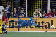 New England Revolution goalkeeper Matt Turner (30) can't make the save on a goal by Columbus Crew forward Gyasi Zerdes during the second half of a MLS soccer match, Saturday, Sept. 18, 2021, in Foxborough, Mass. (AP Photo/Mary Schwalm)