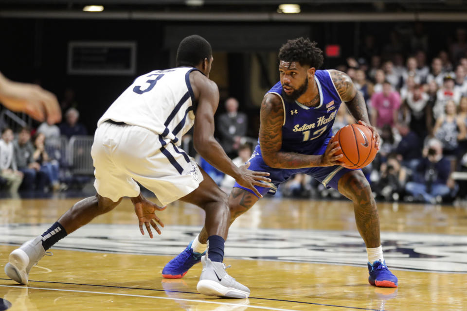 Seton Hall guard Myles Powell (13) looks to drive on Butler guard Kamar Baldwin (3) in the second half of an NCAA college basketball game in Indianapolis, Wednesday, Jan. 15, 2020. Seton Hall defeated Butler 78-70. (AP Photo/Michael Conroy)