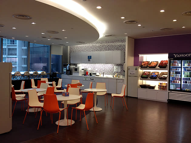 A shot of the Yahoo Singapore pantry -- buffet spread at the far end, with kitchen appliances flanked by a snack shelf and a drink chiller -- all free-of-charge. (Yahoo photo/Jeanette Tan)