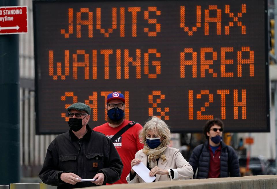 New Yorkers arrive at the Javits Center Covid-19 vaccination center on 13 April 2021 (AFP via Getty Images)