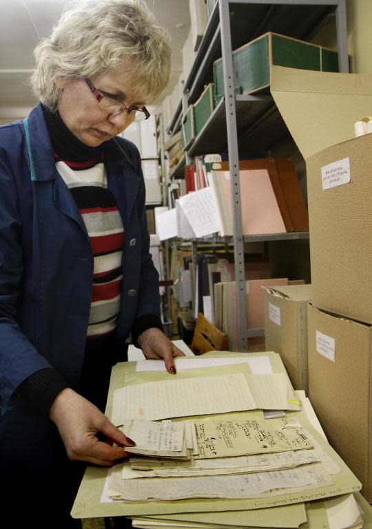 An archivist sorts through old Yiddish and Hebrew manuscripts in Vilnius as part of a project highlighting pre-war Jewish life in Eastern Europe