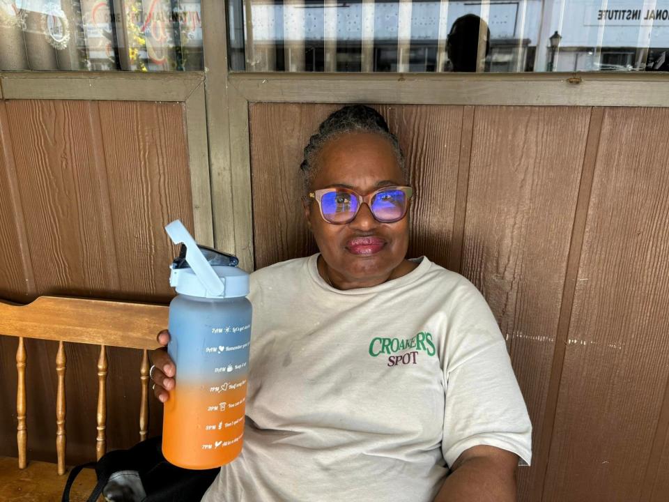 Cheryl Easter of Petersburg stays hydrated in Petersburg during a heat wave in July 2024.