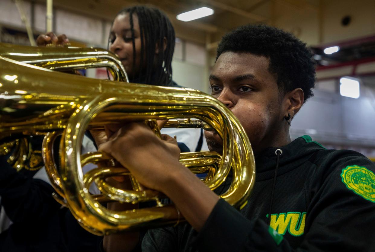 Forever Illustrating Real Entertainment (FIRE) member Teyon Conway performs in front of a large crowd during the 8th annual Harvest Festival at University High School Academy in Detroit on Wednesday, Nov. 22, 2023.